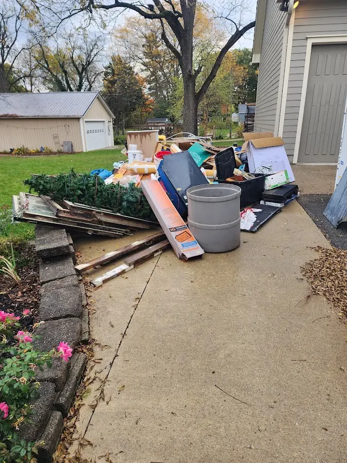 Dumpster being loaded with debris for Roofing Dumpster Rental in Longswamp